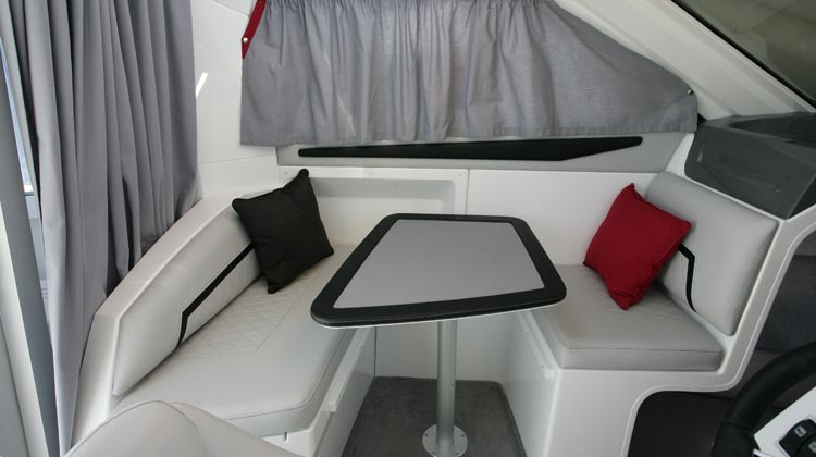 U-dinette with drop-down/removable table and optional cushion to convert to berth